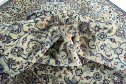 Surface texture of 2000s Nain rug with natural Wool and intricate pattern