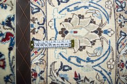 Backside of handmade 2000s Nain rug showing knot structure and weave density