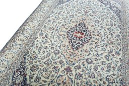 Backside of handmade 2000s Nain rug showing knot structure and weave density