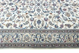 Corner detail of 2000s Nain rug showing border pattern and Wool pile
