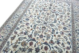 Backside of handmade 2000s Nain rug showing knot structure and weave density