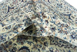 Surface texture of 2000s Nain rug with natural Wool and intricate pattern