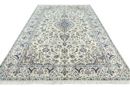 Surface texture of 2000s Nain rug with natural Wool and intricate pattern