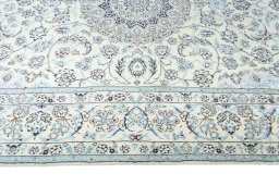 Corner detail of New Nain rug showing border pattern and Wool pile