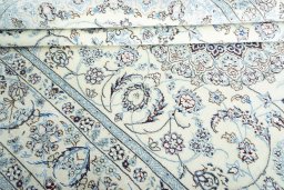 Close-up detail of New Nain rug from Iran / Persia showing Wool weave