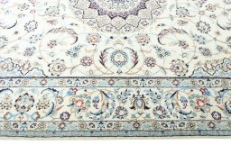 Corner detail of 2000s Nain rug showing border pattern and Wool pile