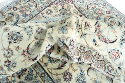 Surface texture of 2000s Nain rug with natural Wool and intricate pattern