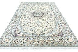 Surface texture of 2000s Nain rug with natural Wool and intricate pattern