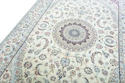 Backside of handmade 2000s Nain rug showing knot structure and weave density