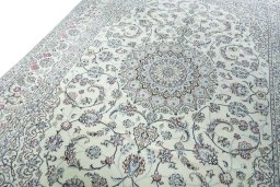 Backside of handmade New Nain rug showing knot structure and weave density