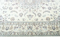 Corner detail of New Nain rug showing border pattern and Wool pile