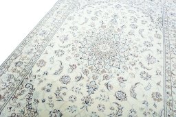 Backside of handmade New Nain rug showing knot structure and weave density