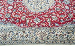 Corner detail of 2000s Nain rug showing border pattern and Wool pile
