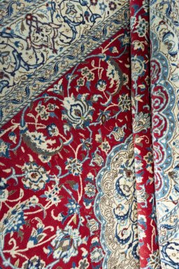 Close-up detail of 2000s Nain rug from Iran / Persia showing Wool weave