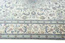 Corner detail of 2000s Nain rug showing border pattern and Wool pile