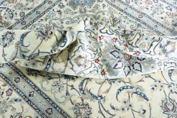 Surface texture of 2000s Nain rug with natural Wool and intricate pattern