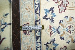 Backside of handmade 2000s Nain rug showing knot structure and weave density