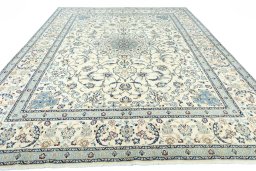 Surface texture of 2000s Nain rug with natural Wool and intricate pattern