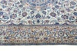 Corner detail of 2000s Nain rug showing border pattern and Wool pile