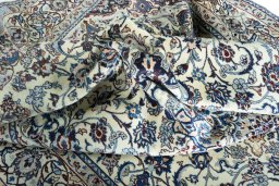 Surface texture of 2000s Nain rug with natural Wool and intricate pattern