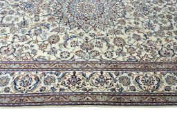 Corner detail of 2000s Nain rug showing border pattern and Wool pile
