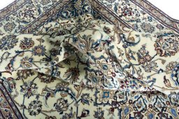 Surface texture of 2000s Nain rug with natural Wool and intricate pattern
