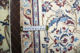Backside of handmade 2000s Nain rug showing knot structure and weave density