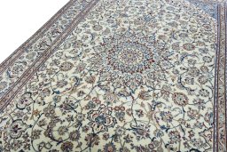 Backside of handmade 2000s Nain rug showing knot structure and weave density
