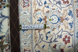 Backside of handmade New Nain rug showing knot structure and weave density
