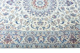 Corner detail of 2000s Nain rug showing border pattern and Wool pile