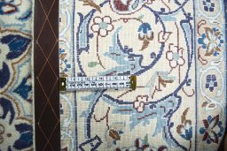 Backside of handmade 2000s Nain rug showing knot structure and weave density