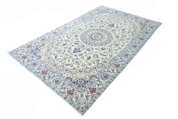 Corner detail of 2000s Nain rug showing border pattern and Wool pile