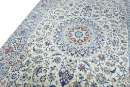 Backside of handmade 2000s Nain rug showing knot structure and weave density