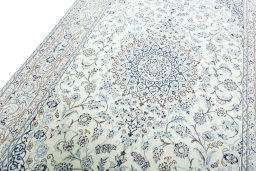 Backside of handmade New Nain rug showing knot structure and weave density