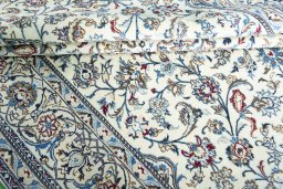Surface texture of 2000s Nain rug with natural Wool and intricate pattern