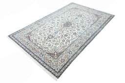 Corner detail of 2000s Nain rug showing border pattern and Wool pile