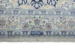 Corner detail of 2000s Nain rug showing border pattern and Wool pile