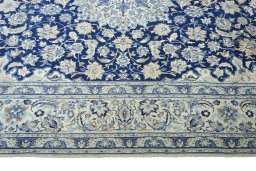 Close-up detail of 2000s Nain rug from Iran / Persia showing Wool weave