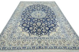 Surface texture of 2000s Nain rug with natural Wool and intricate pattern