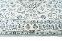 Corner detail of 2000s Nain rug showing border pattern and Wool pile