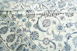 Surface texture of 2000s Nain rug with natural Wool and intricate pattern