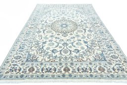 Surface texture of 2000s Nain rug with natural Wool and intricate pattern