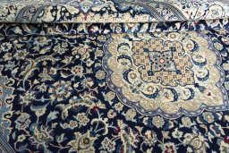 Close-up detail of 2000s Nain rug from Iran / Persia showing Wool weave