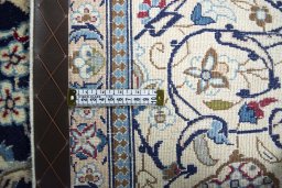 Backside of handmade 2000s Nain rug showing knot structure and weave density