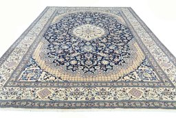Surface texture of 2000s Nain rug with natural Wool and intricate pattern