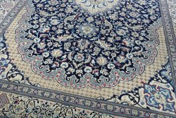 Close-up detail of 2000s Nain rug from Iran / Persia showing Wool weave