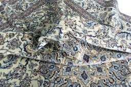 Surface texture of 2000s Nain rug with natural Wool and intricate pattern