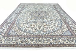 Surface texture of 2000s Nain rug with natural Wool and intricate pattern