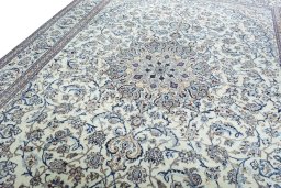Backside of handmade 2000s Nain rug showing knot structure and weave density