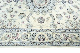 Corner detail of New Nain rug showing border pattern and Wool pile